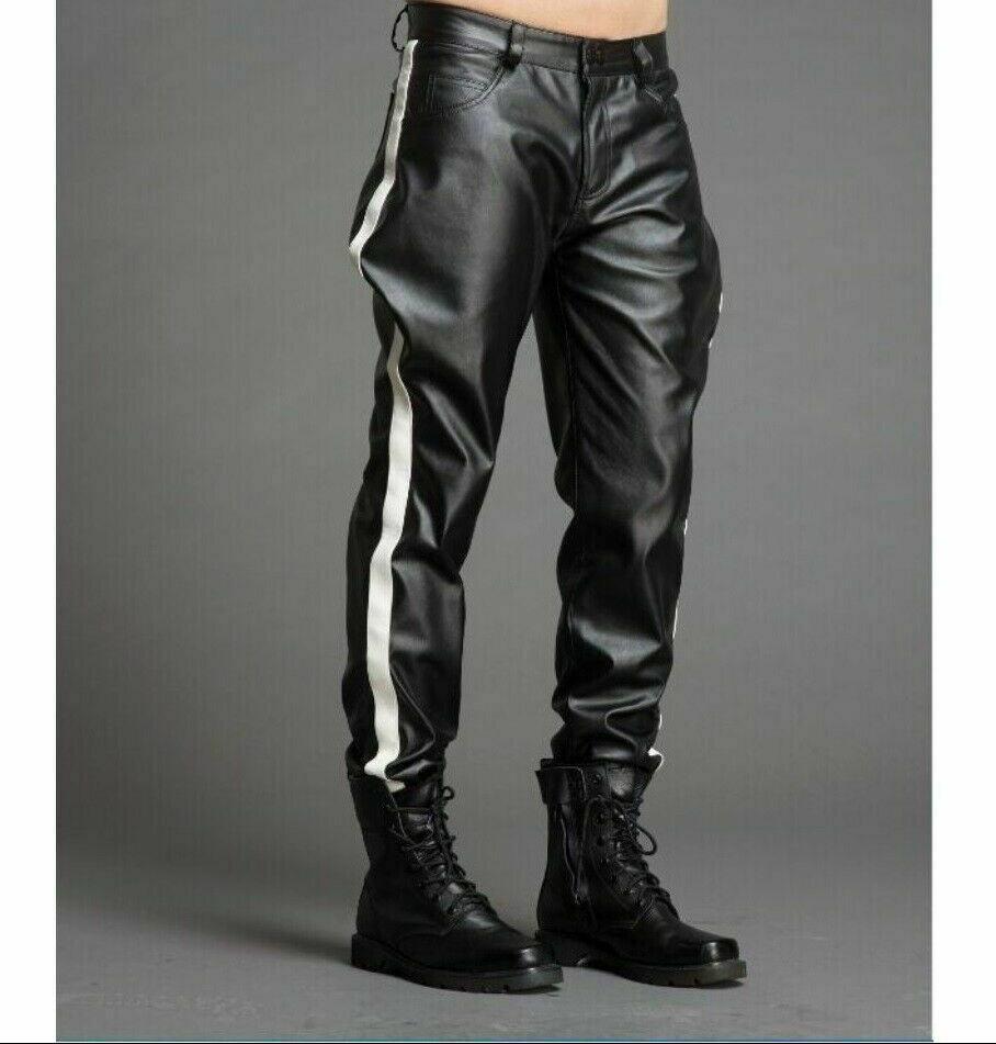 A person standing wearing black genuine leather trouser pants with white stripes on the legs, paired with black boots.